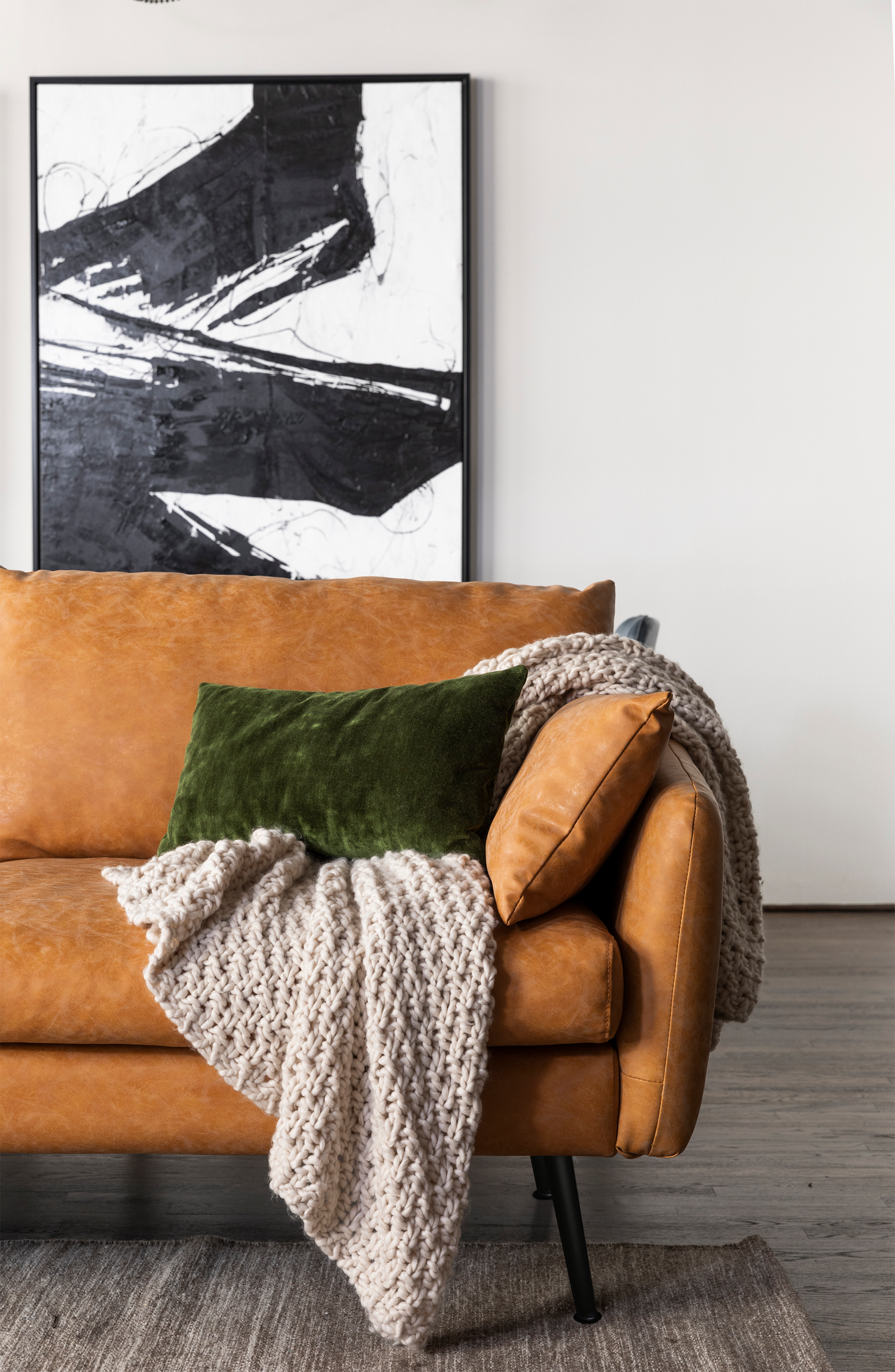 park sectional sofa shown in distressed vegan leather with black legs left facing