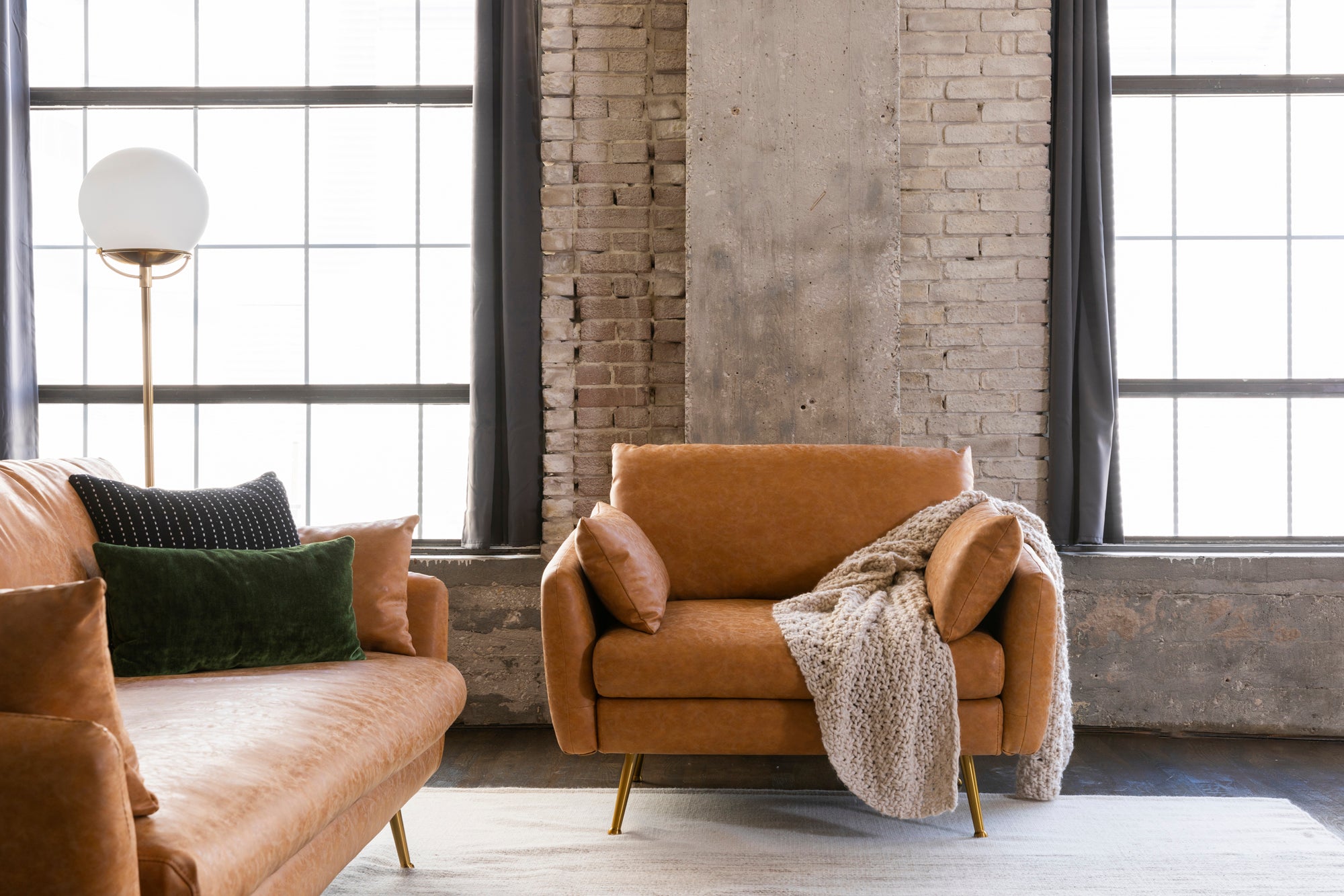 park armchair shown in distressed vegan leather with gold legs