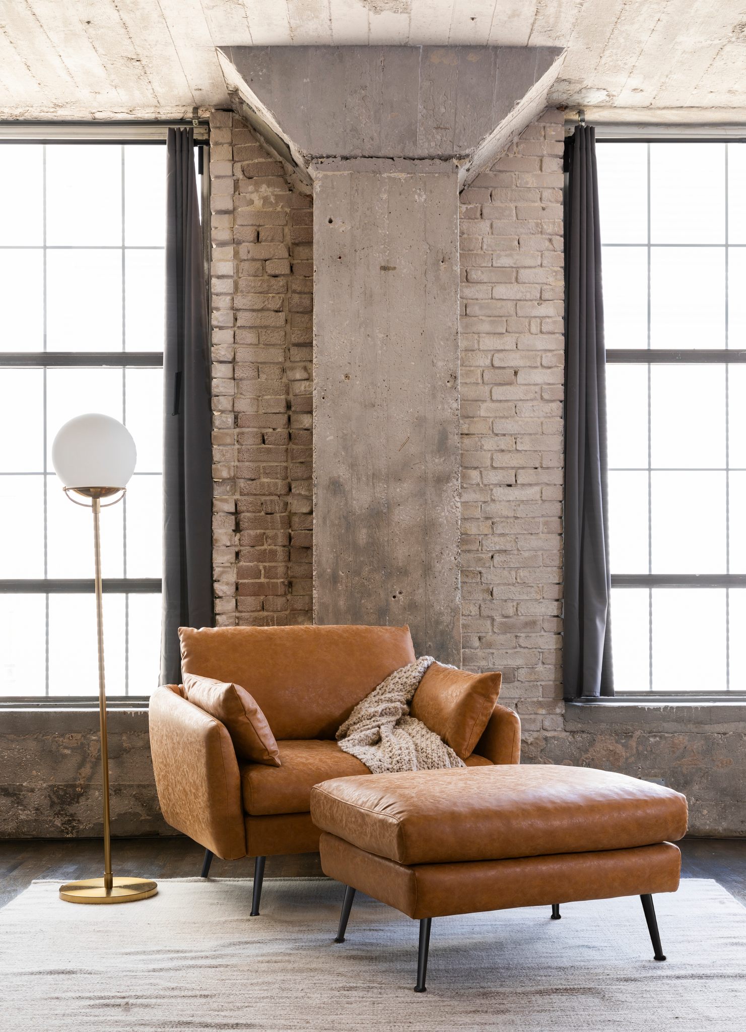 park ottoman shown in distressed vegan leather with black legs