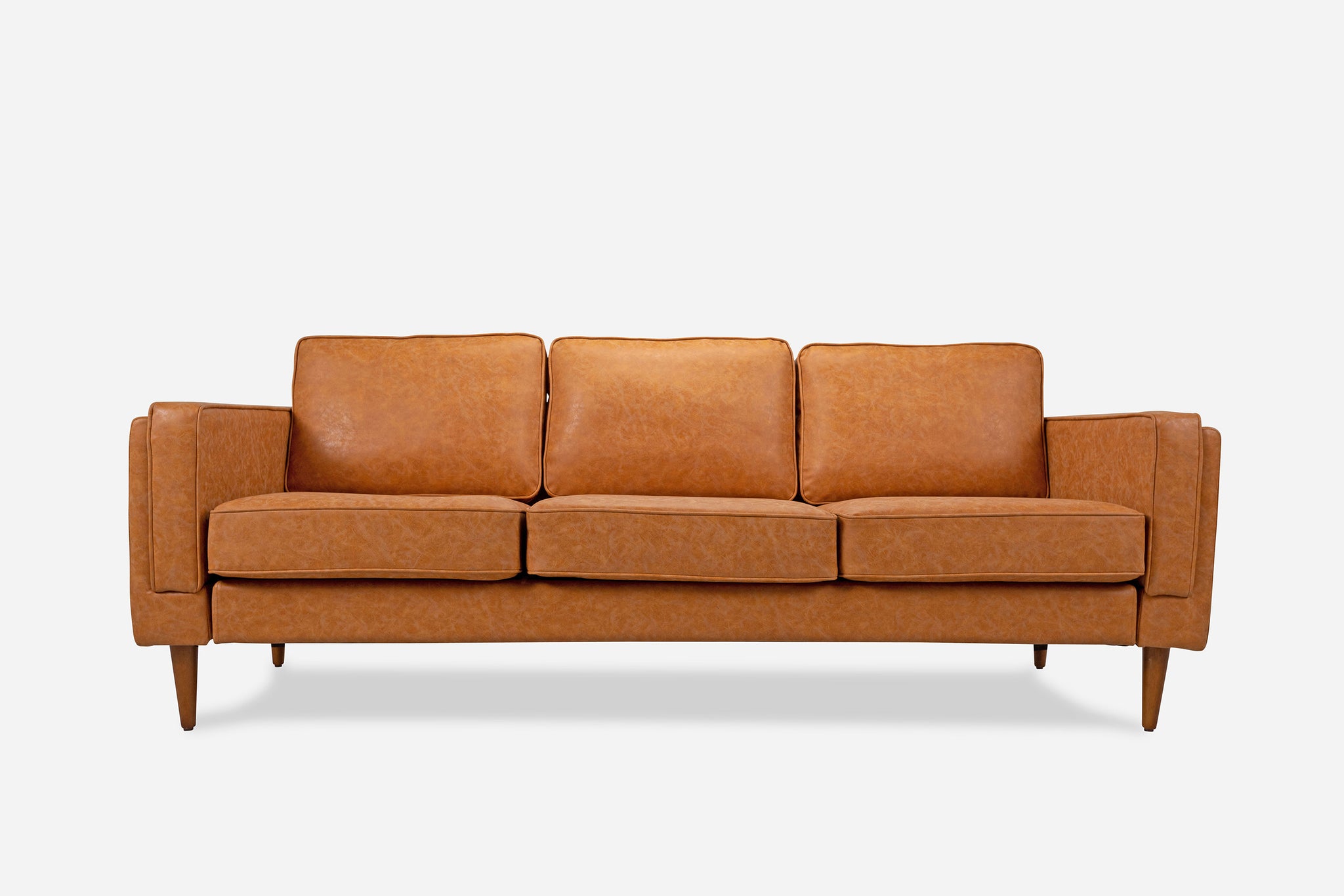 albany sofa shown in distressed vegan leather with walnut legs