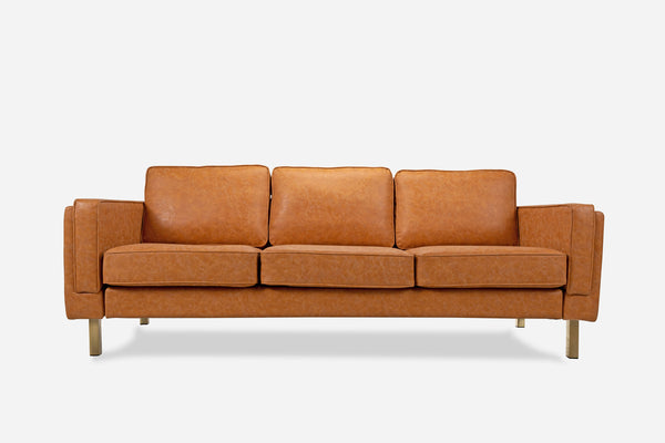 albany sofa shown in distressed vegan leather with gold legs