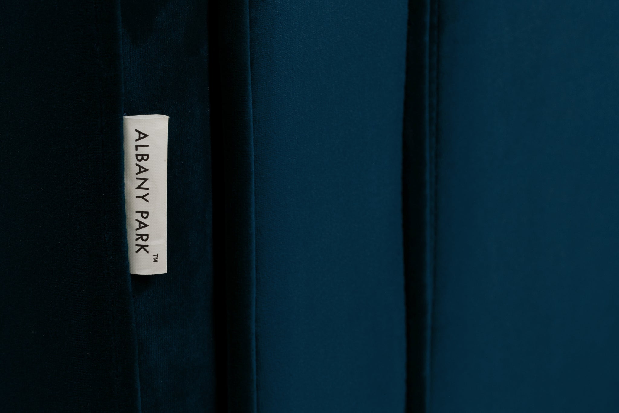 albany armchair shown in blue velvet with walnut legs