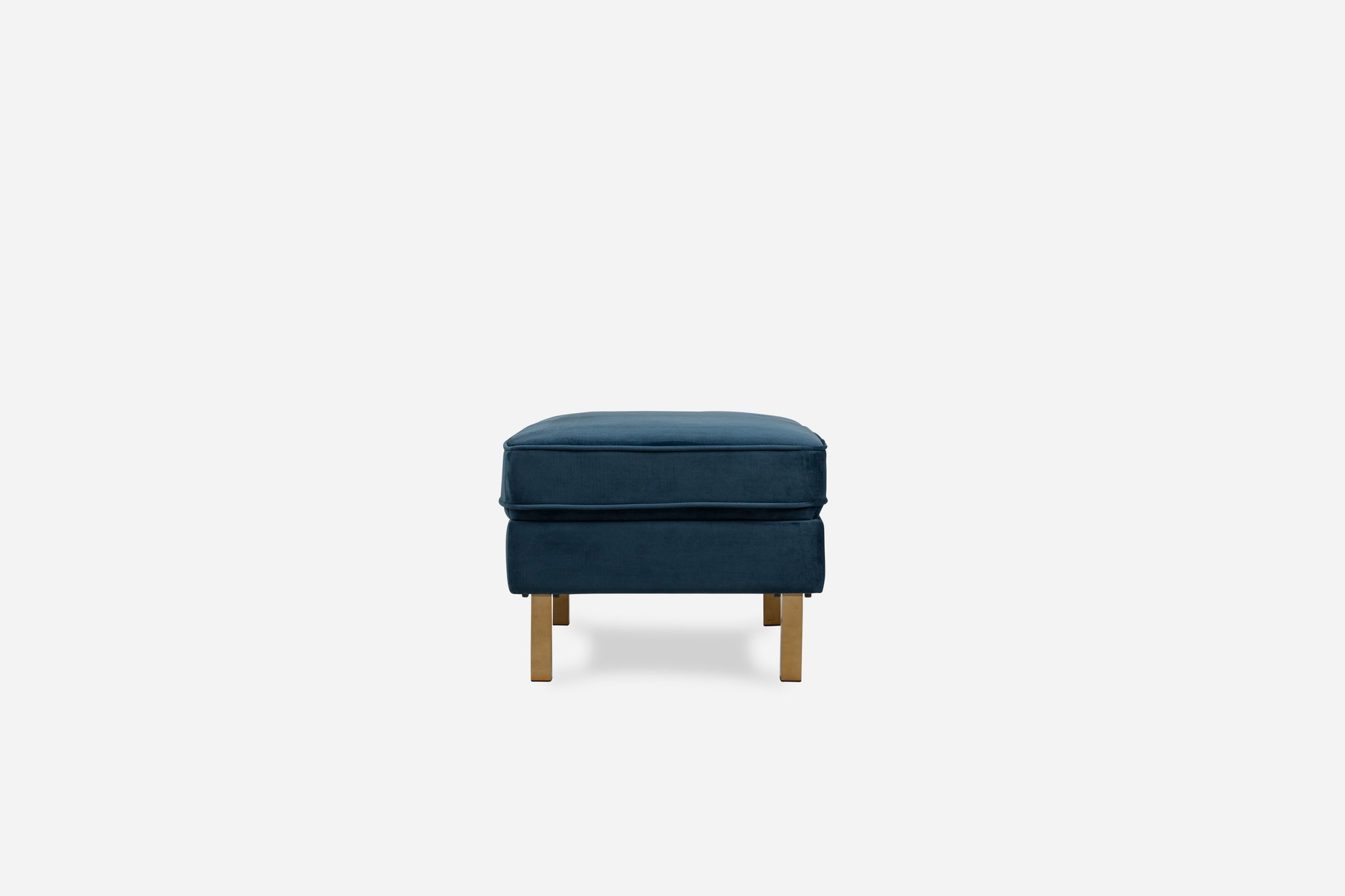 albany ottoman shown in blue velvet with gold legs