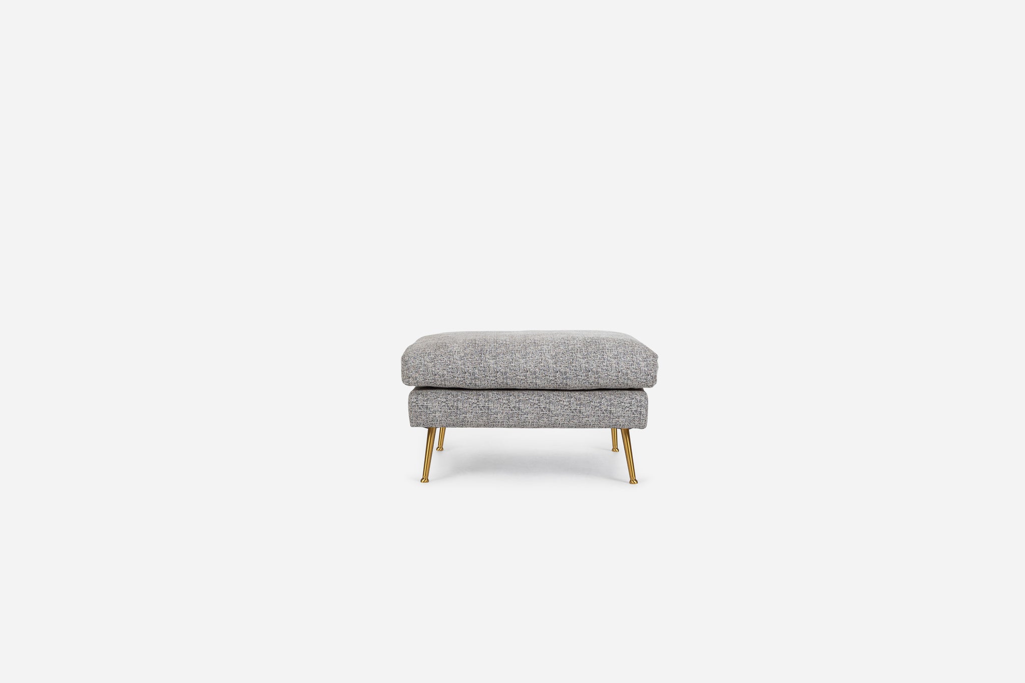 park ottoman shown in grey fabric with gold legs