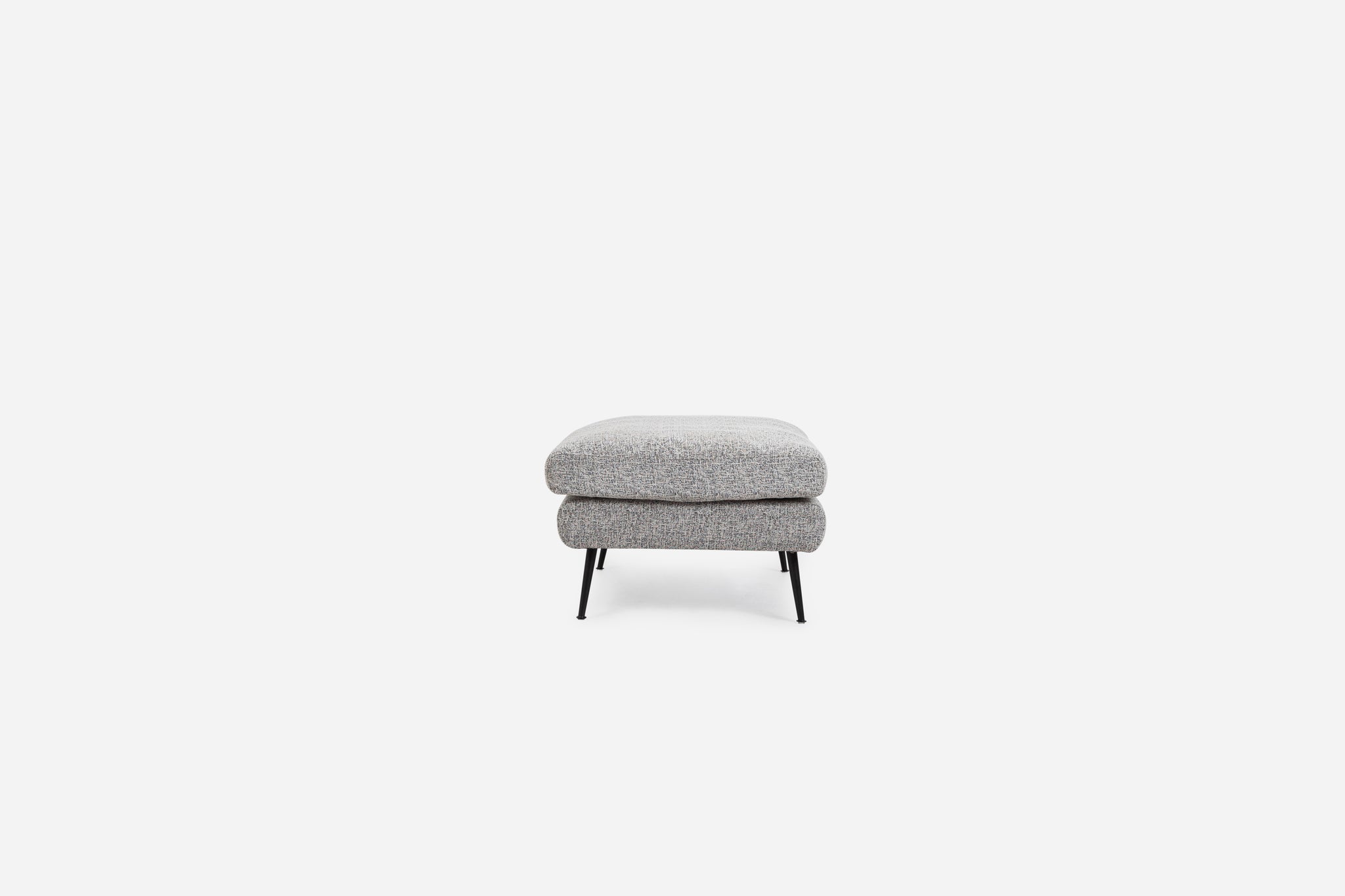 park ottoman shown in grey fabric with black legs