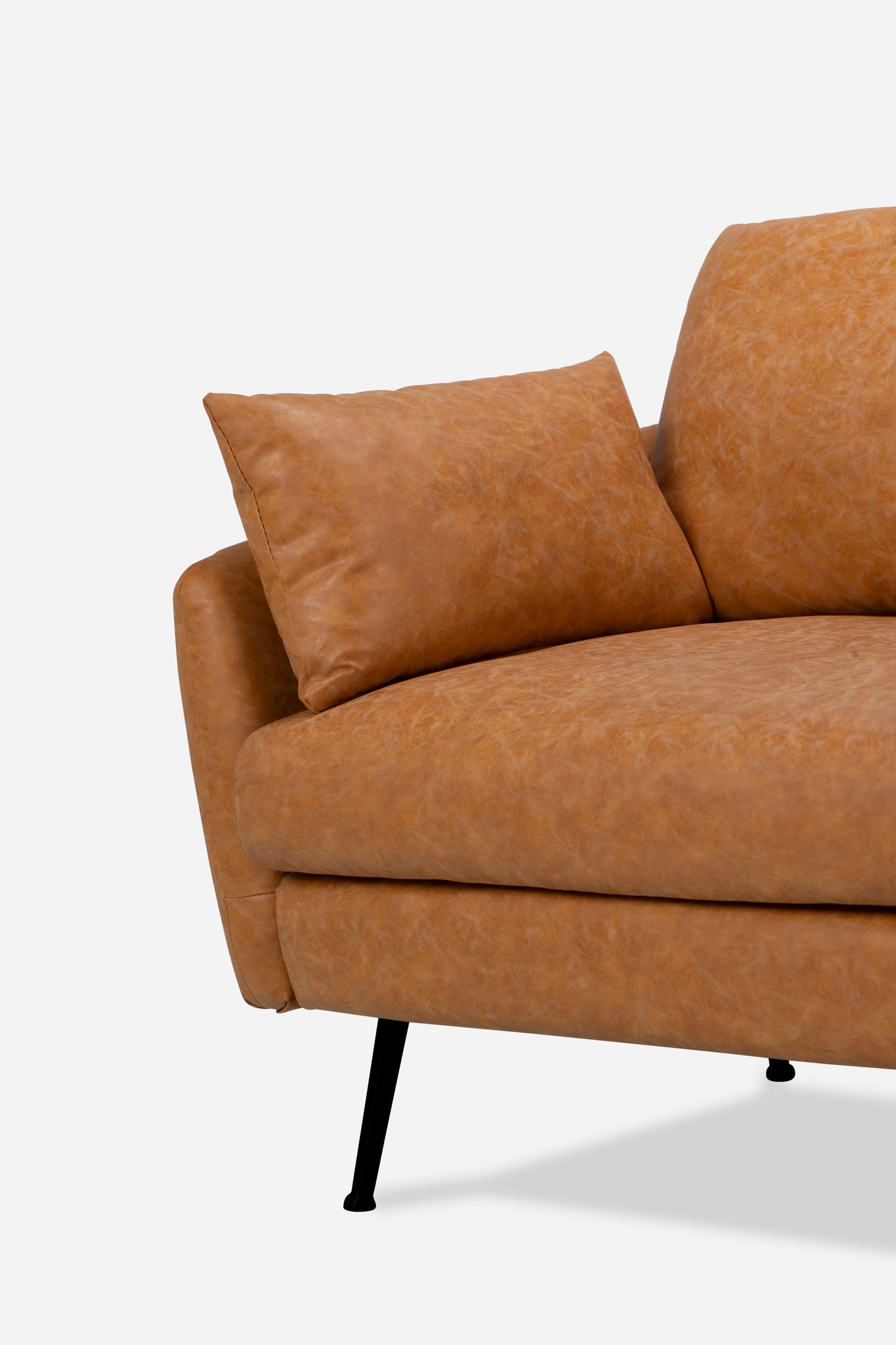park armchair shown in distressed vegan leather with black legs