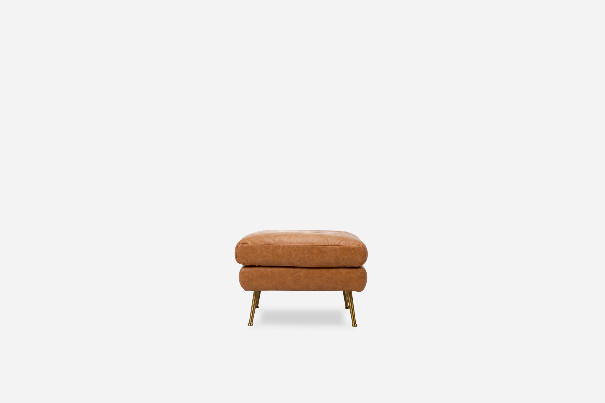 park ottoman shown in distressed vegan leather with gold legs