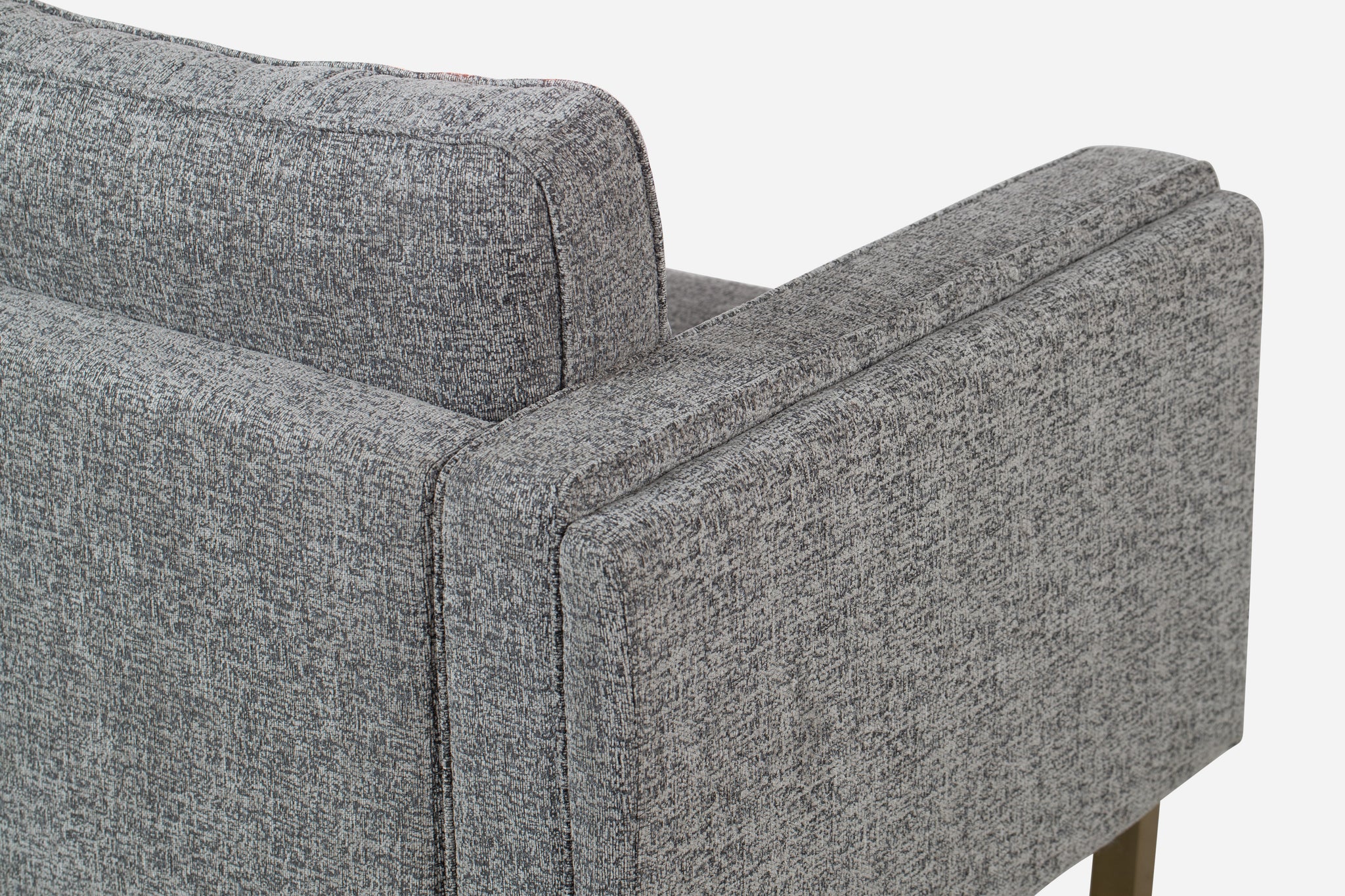 albany armchair shown in grey fabric with gold legs