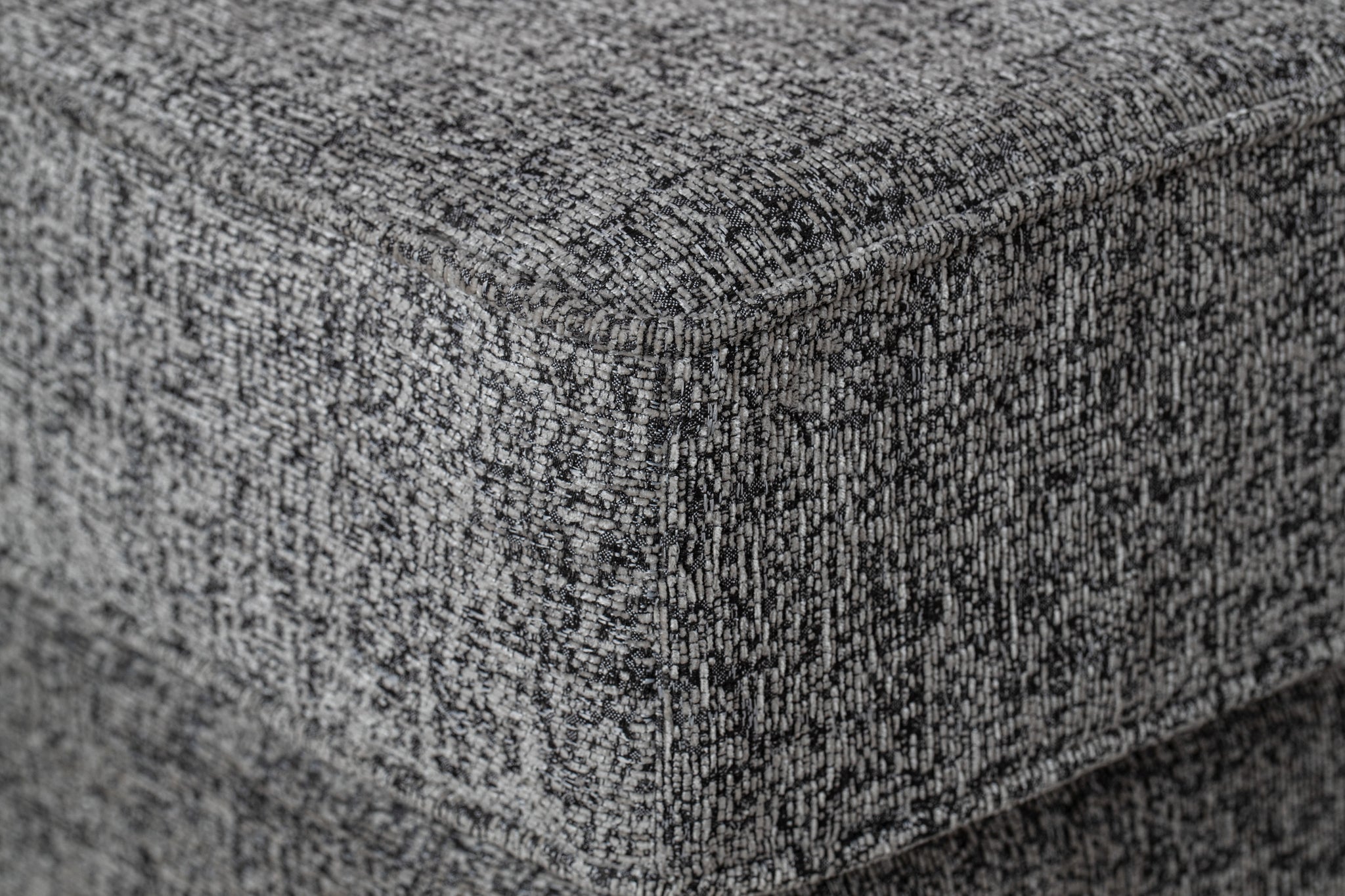 albany armchair shown in grey fabric with gold legs