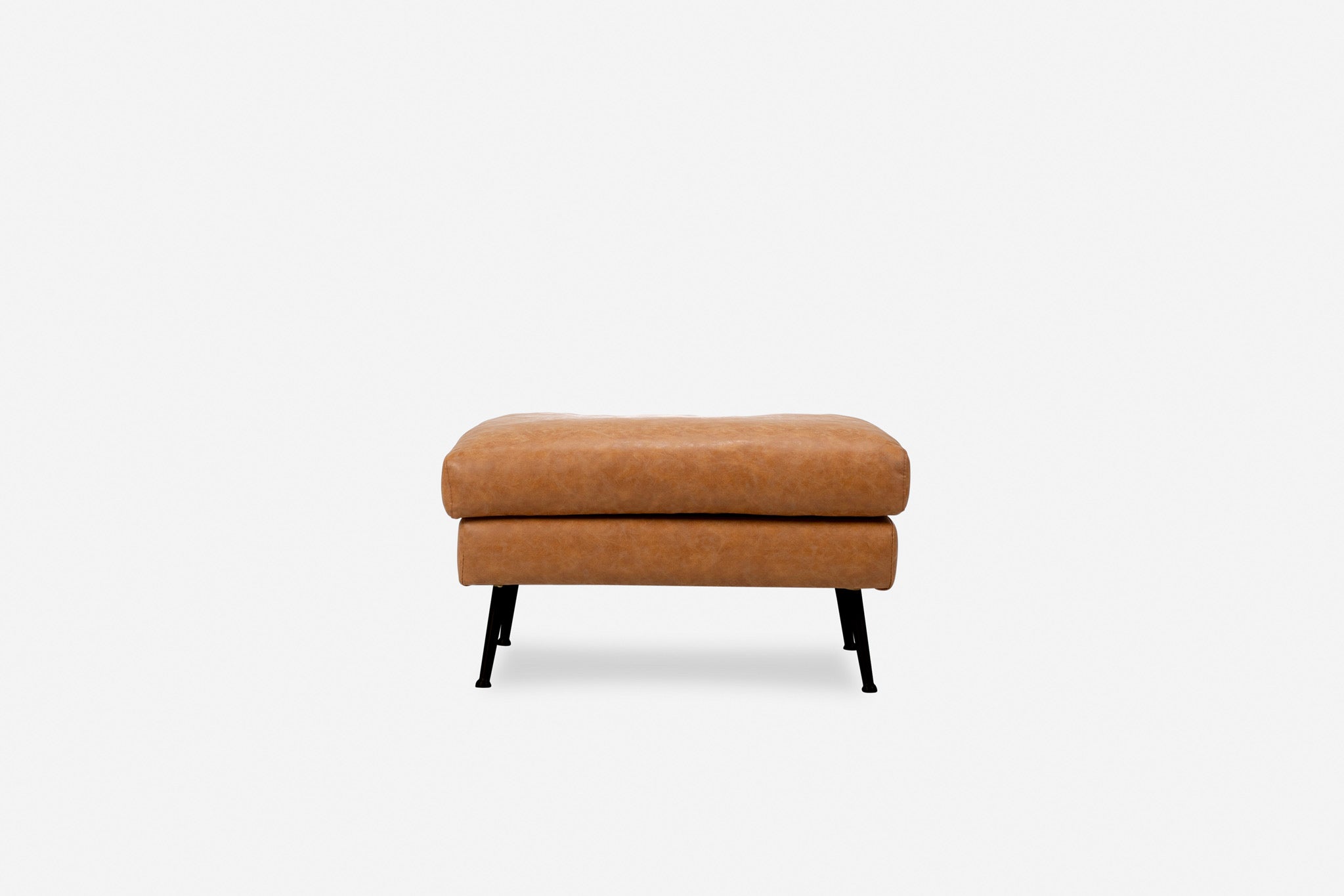 park ottoman shown in distressed vegan leather with black legs