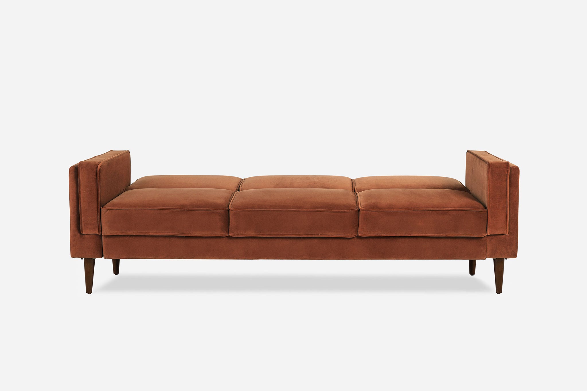 front view of the albany sleeper sofa in rust velvet and walnut legs