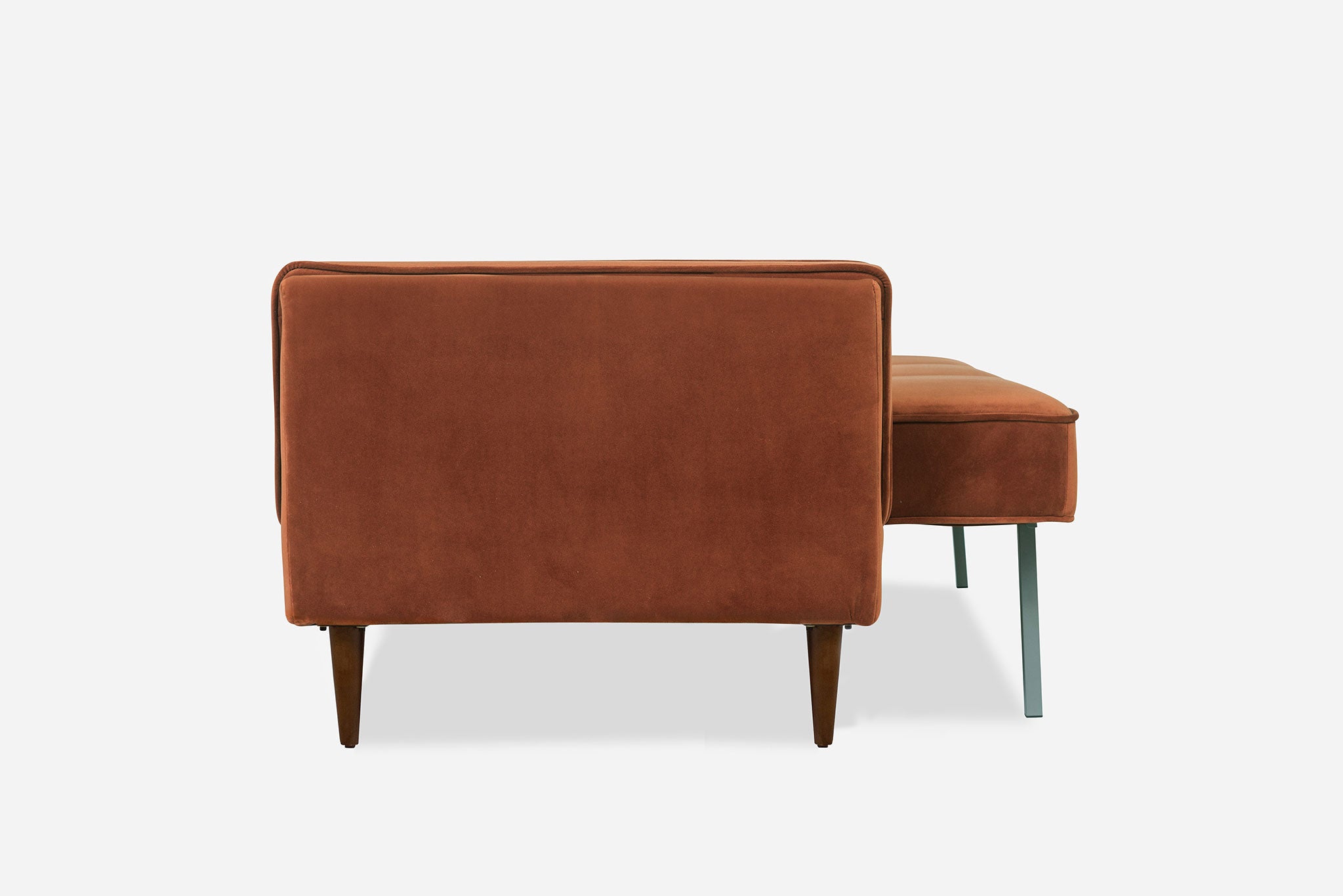 lateral view of the albany sleeper sofa in rust velvet and walnut legs