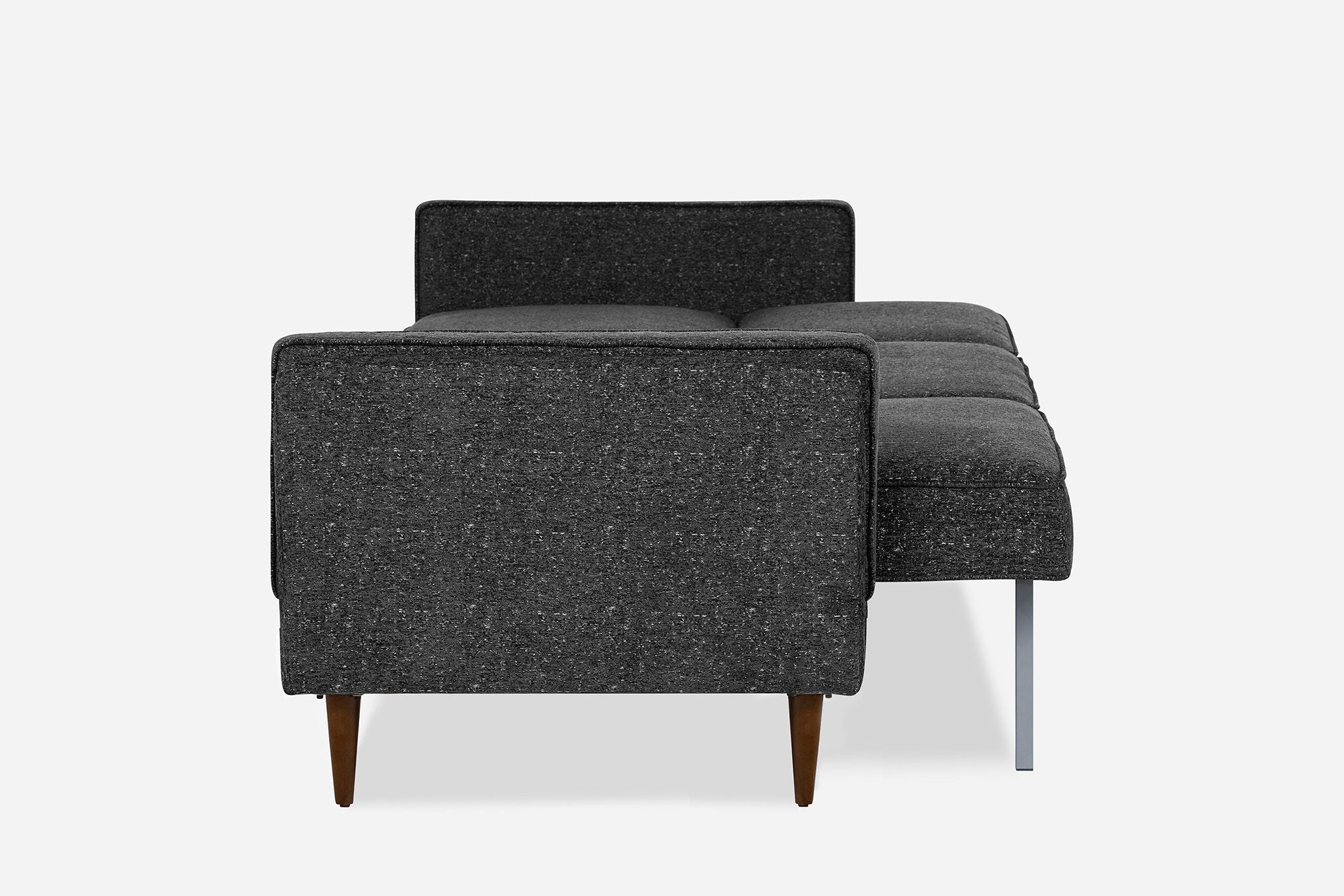 lateral view of the albany sleeper sofa as a bed in charcoal with walnut legs