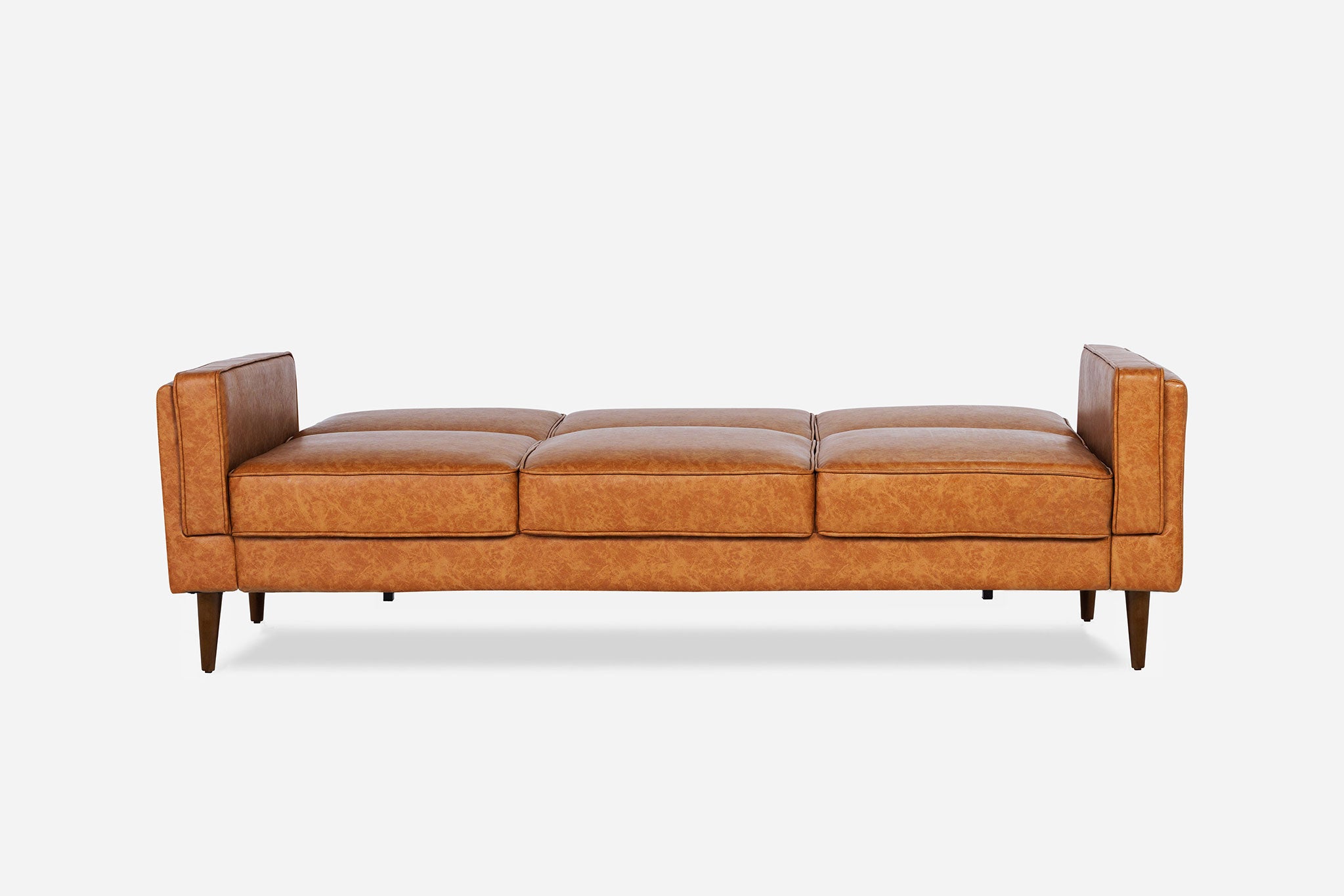 front view of the albany sleeper sofa as a bed in vegan leather with walnut legs