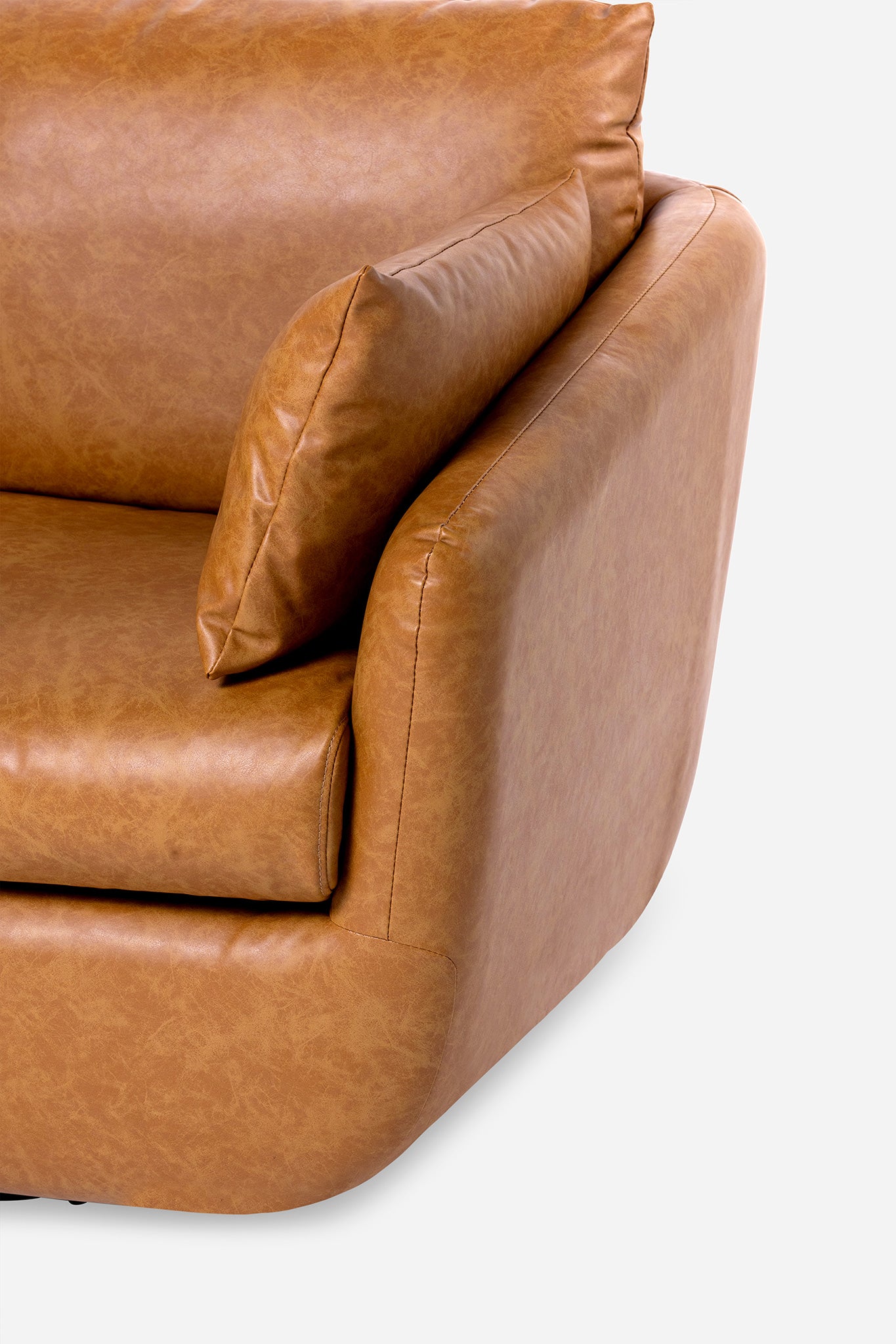 detail of the park swivel armchair in distressed vegan leather