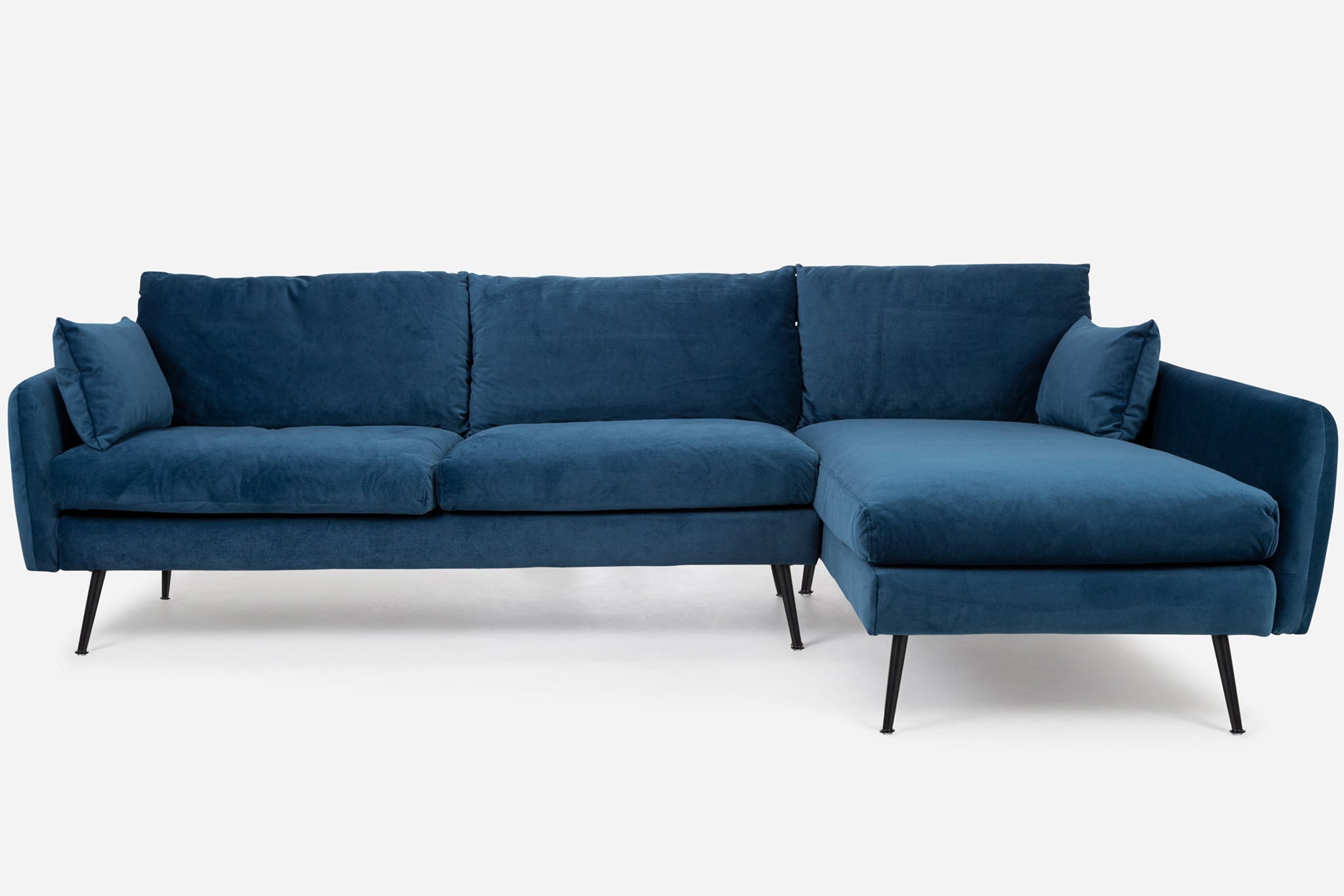 park sectional sofa shown in blue velvet with black legs right facing