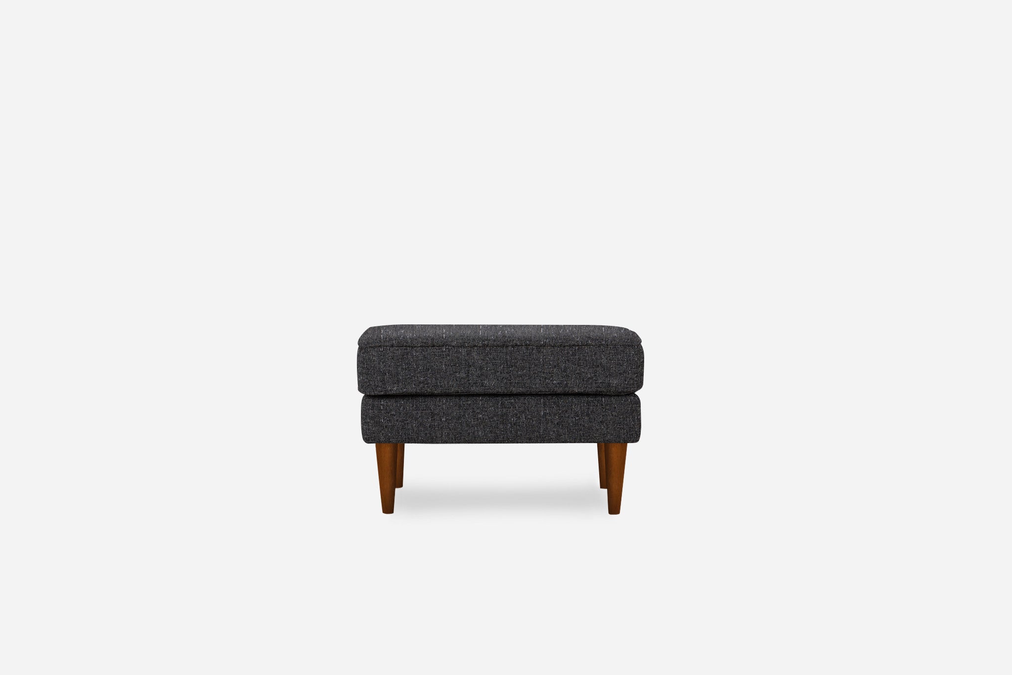 albany ottoman shown in charcoal with walnut legs